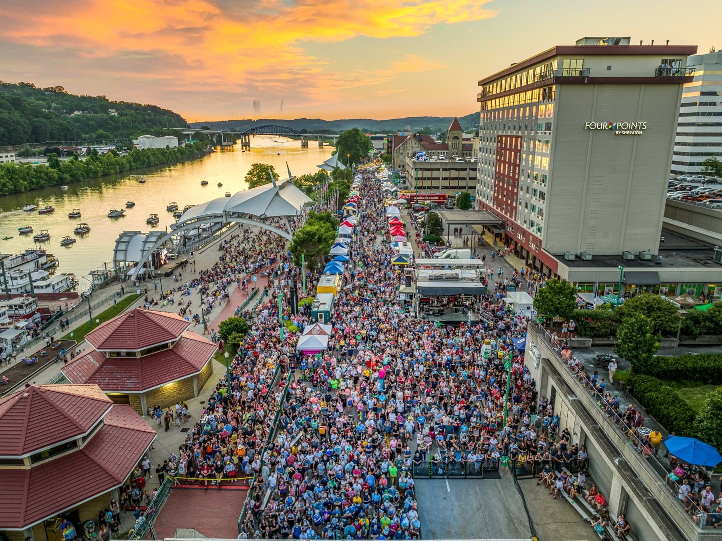 Throngs of people at the Charleston Sternwheel Regatta along the river