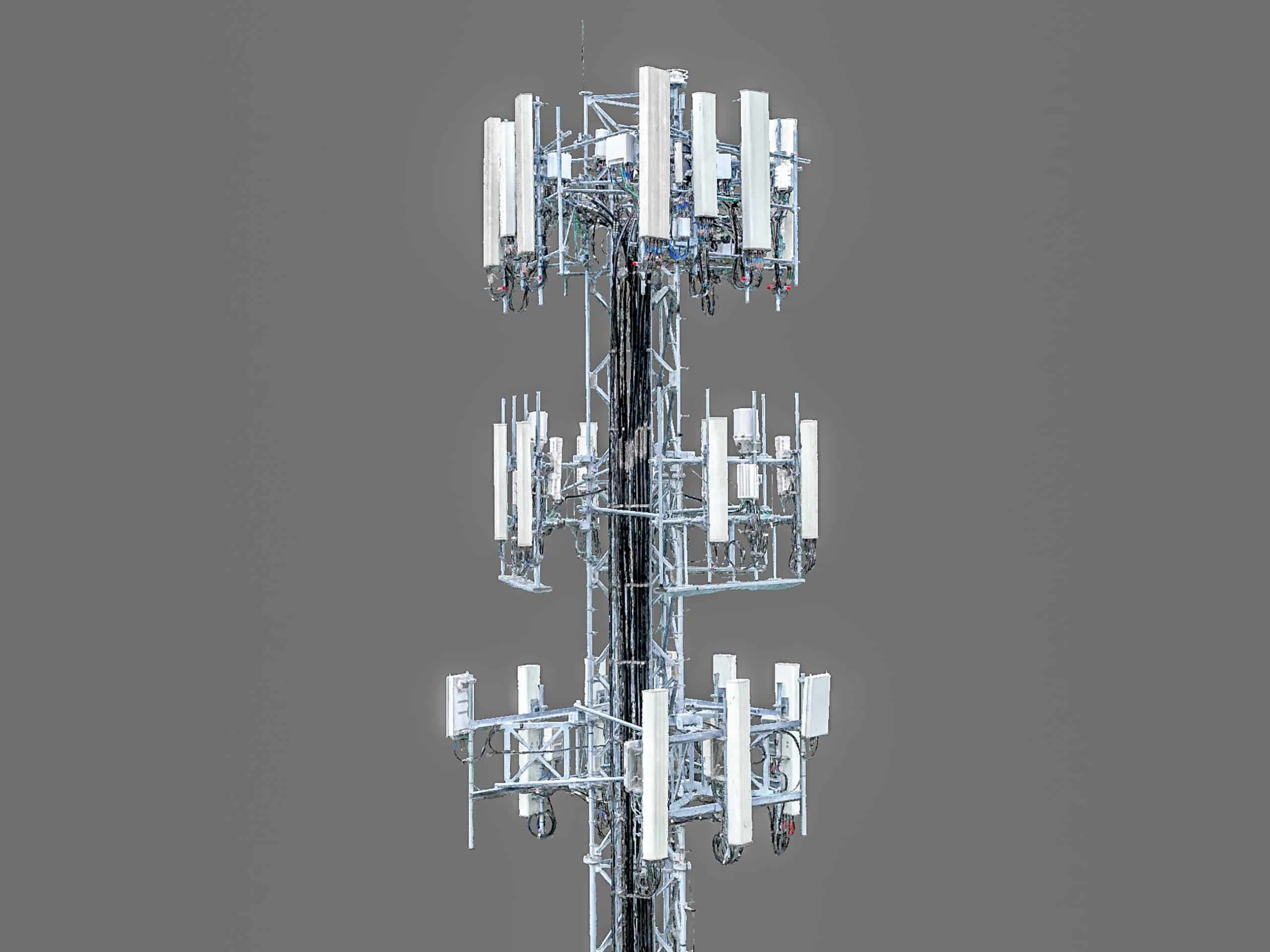 Aerial 3D model of a cell tower with antennas and intricate wire network, captured by UA-Visions' drone technology.