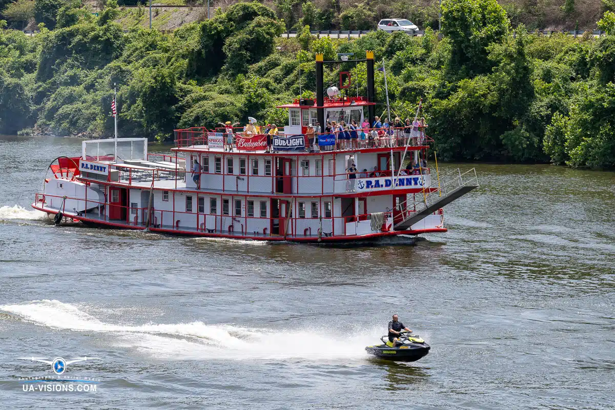 The P.A. Denny paddle boat cruising on the Kanawha River with a jet ski zipping by during the Charleston Sternwheel Regatta 2023.