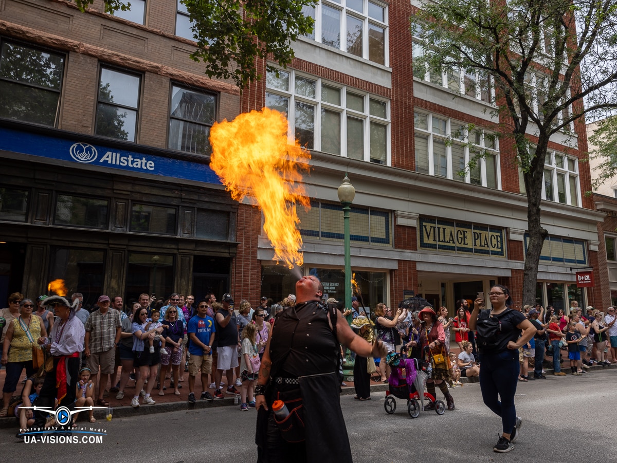 A fire-breather performing a daring act in the Charleston Sternwheel Regatta Funeral Parade.