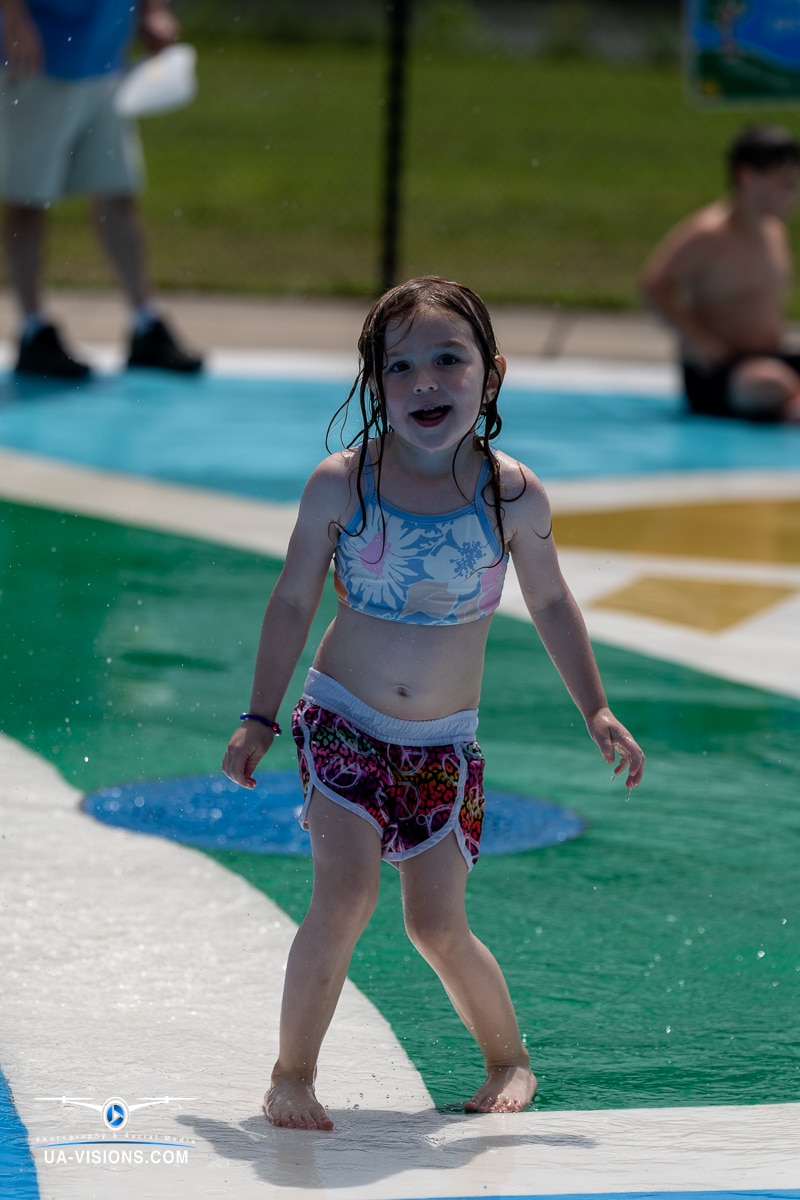 Young girl enjoying a splash pad at Charleston Sternwheel Regatta 2023
