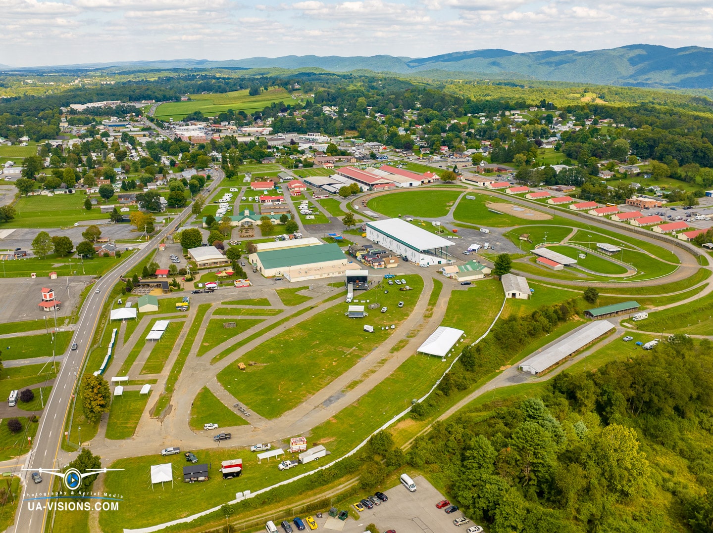 Aerial view of a vibrant community event space in Appalachia, showcasing diverse facilities and green spaces.