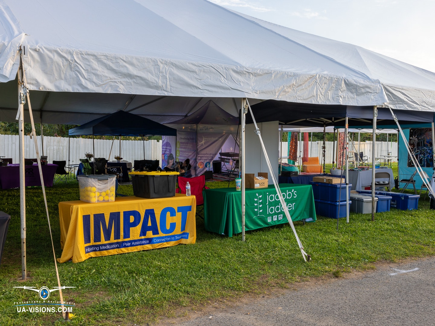 Event tents at Healing Appalachia with the golden hour glow, the marketplace of moments.