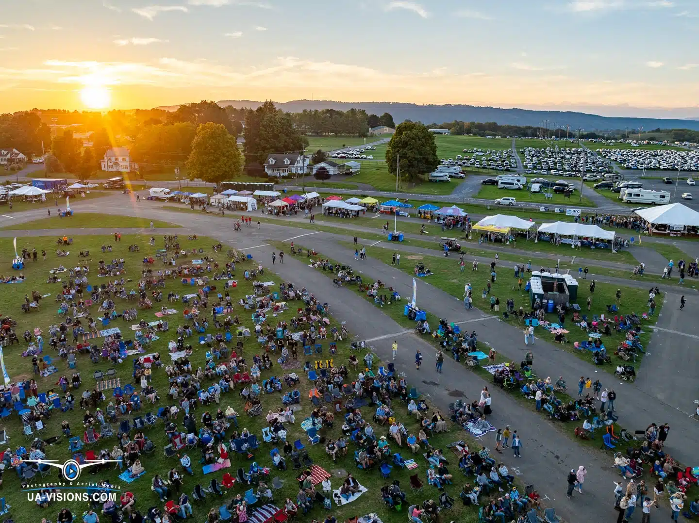 The golden hour casts its warm embrace over the Healing Appalachia festival attendees.