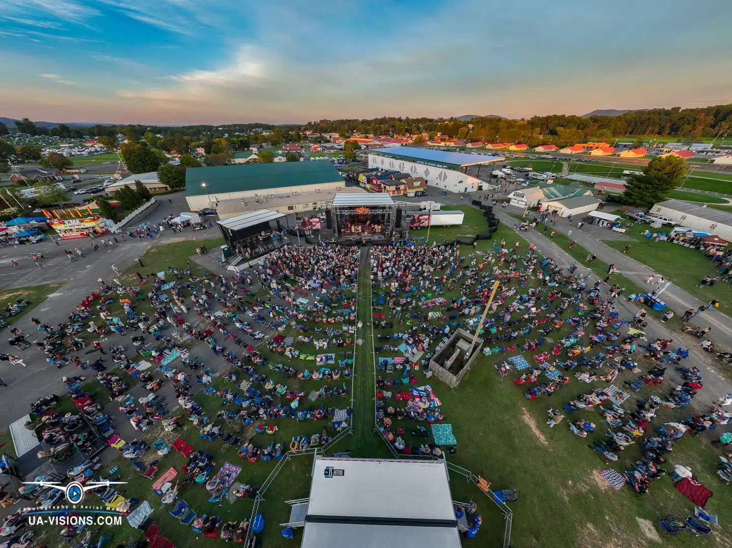 Aerial view of the Healing Appalachia festival crowd, as the sun sets on a day of music and community.