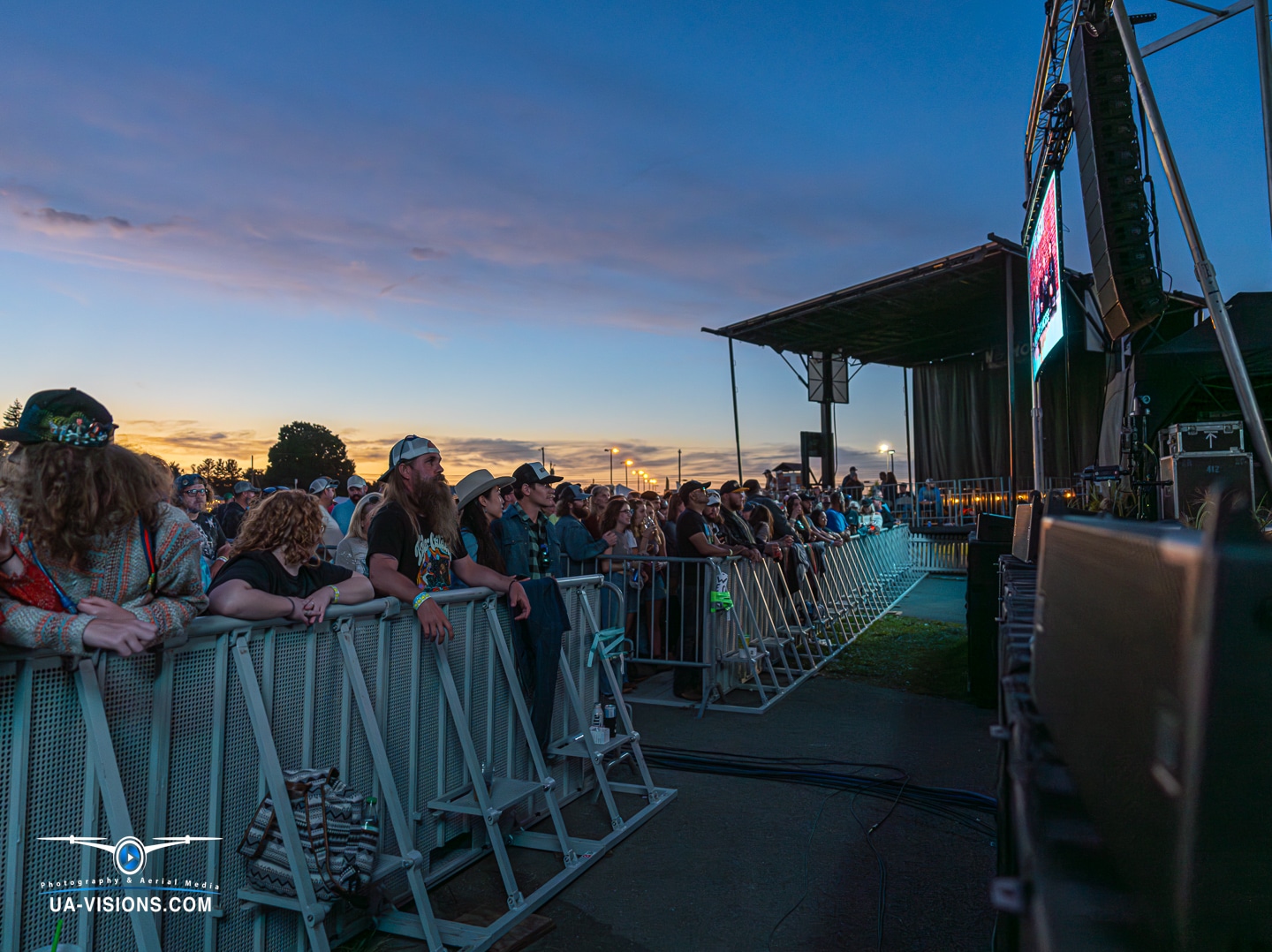 Crowd at Healing Appalachia music festival with sunset backdrop