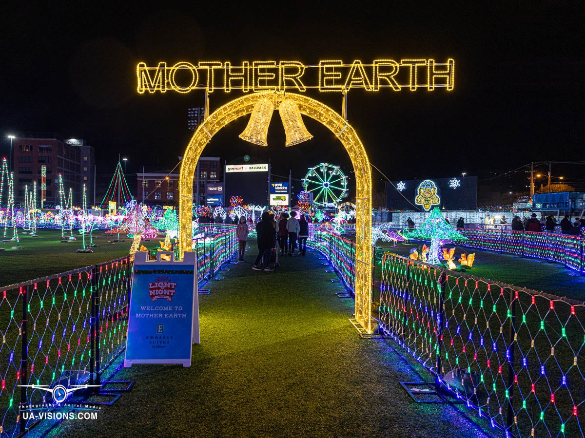 This striking image by UA-Visions features the 'Mother Earth' light display at Charleston's Light the Night event, highlighting environmental themes amidst holiday celebrations. A perfect blend of message and medium.