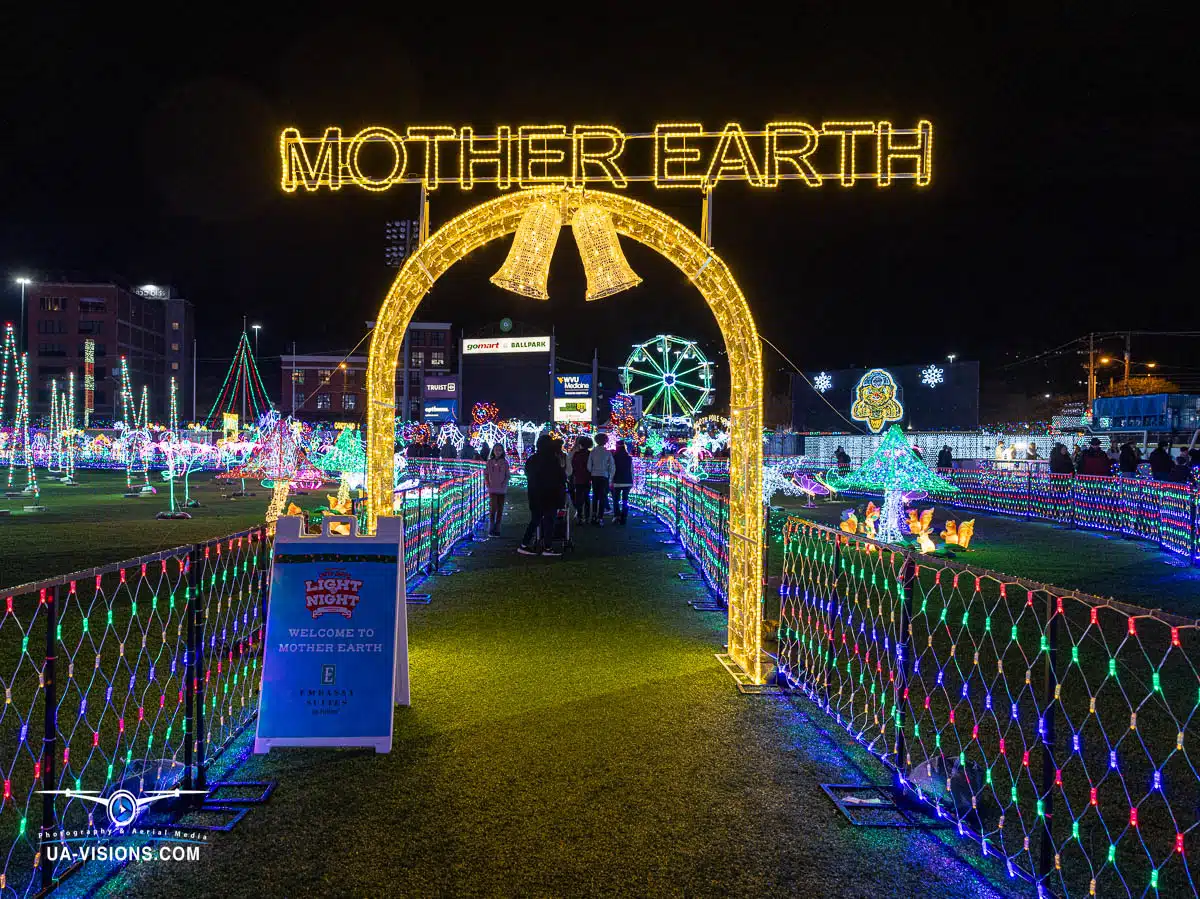 This striking image by UA-Visions features the 'Mother Earth' light display at Charleston's Light the Night event, highlighting environmental themes amidst holiday celebrations. A perfect blend of message and medium.