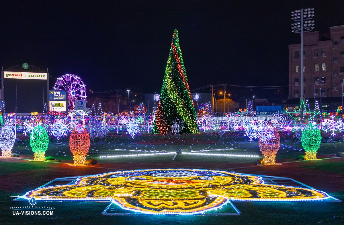 In the heart of Charleston's GoMart Ballpark, UA-Visions captures the enchanting glow of a towering Christmas tree, a beacon of the joyous Light the Night event.