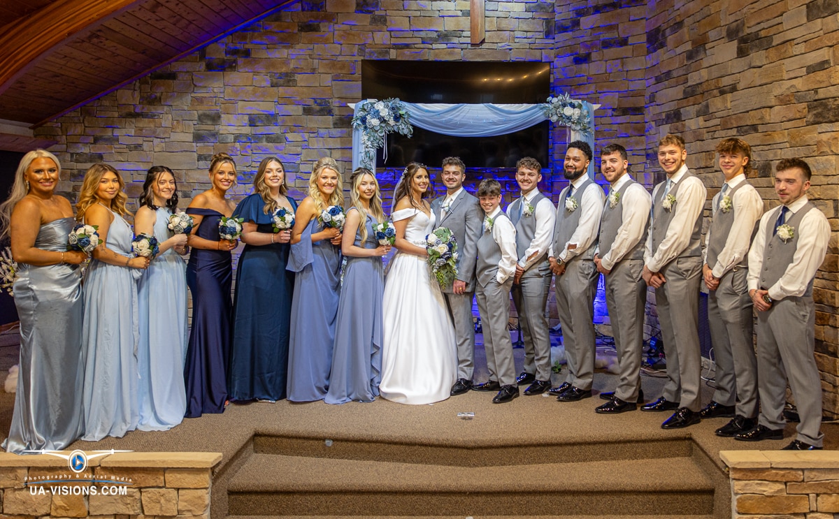 The full wedding party of Katilyn and Logan Gaddy smiling together in Hurricane, WV.