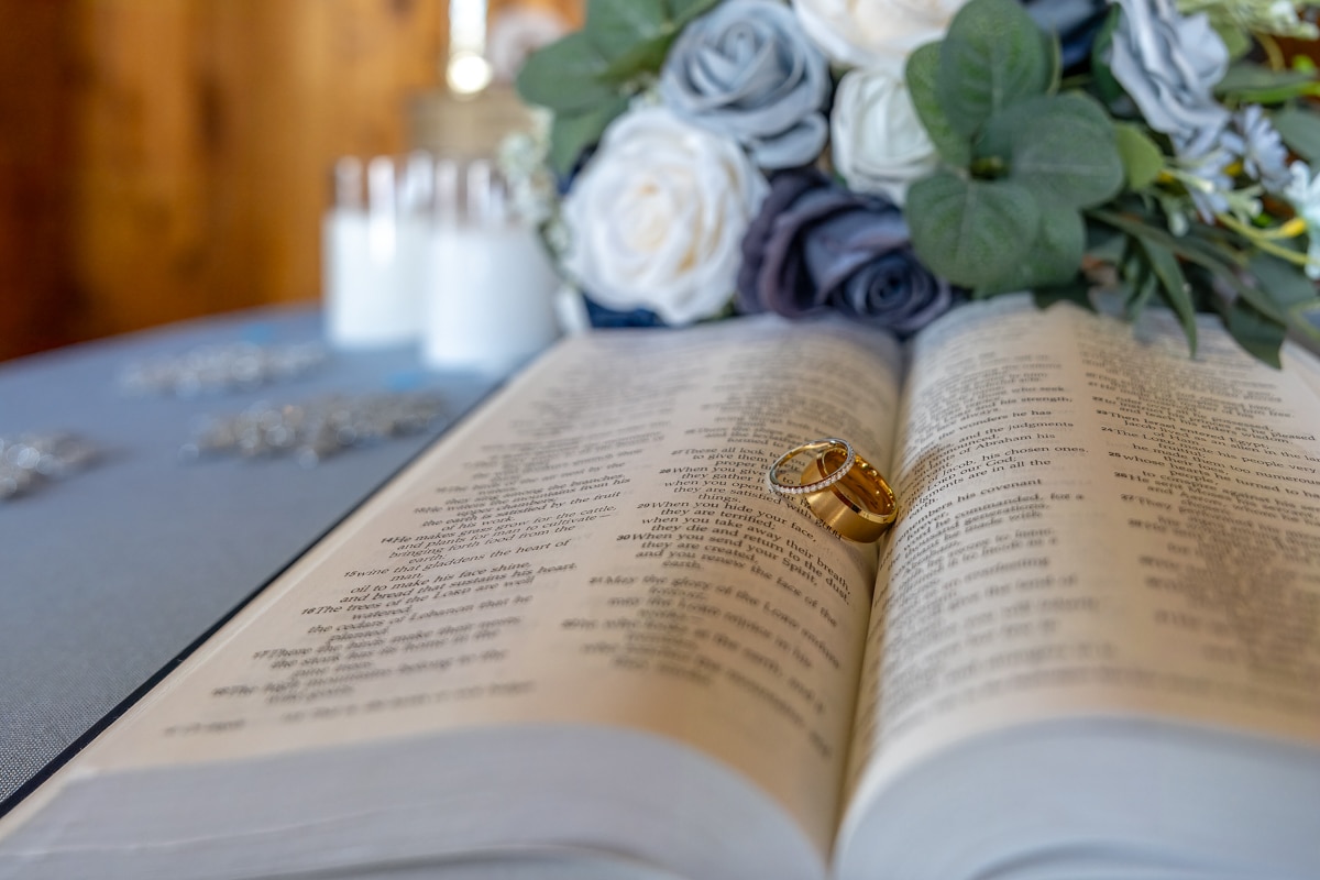 An Bible becomes the resting place for Logan and Katilyn Gaddy's wedding rings, symbolizing their own faith on their special day in Hurricane, WV.