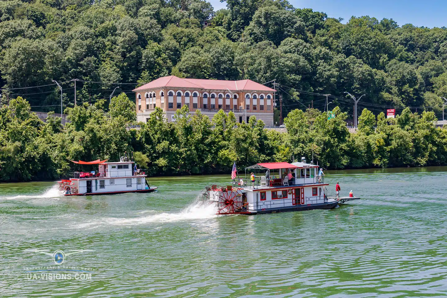 Several sternwheel boats in action during the 2022 Charleston Sternwheel Regatta boat race.