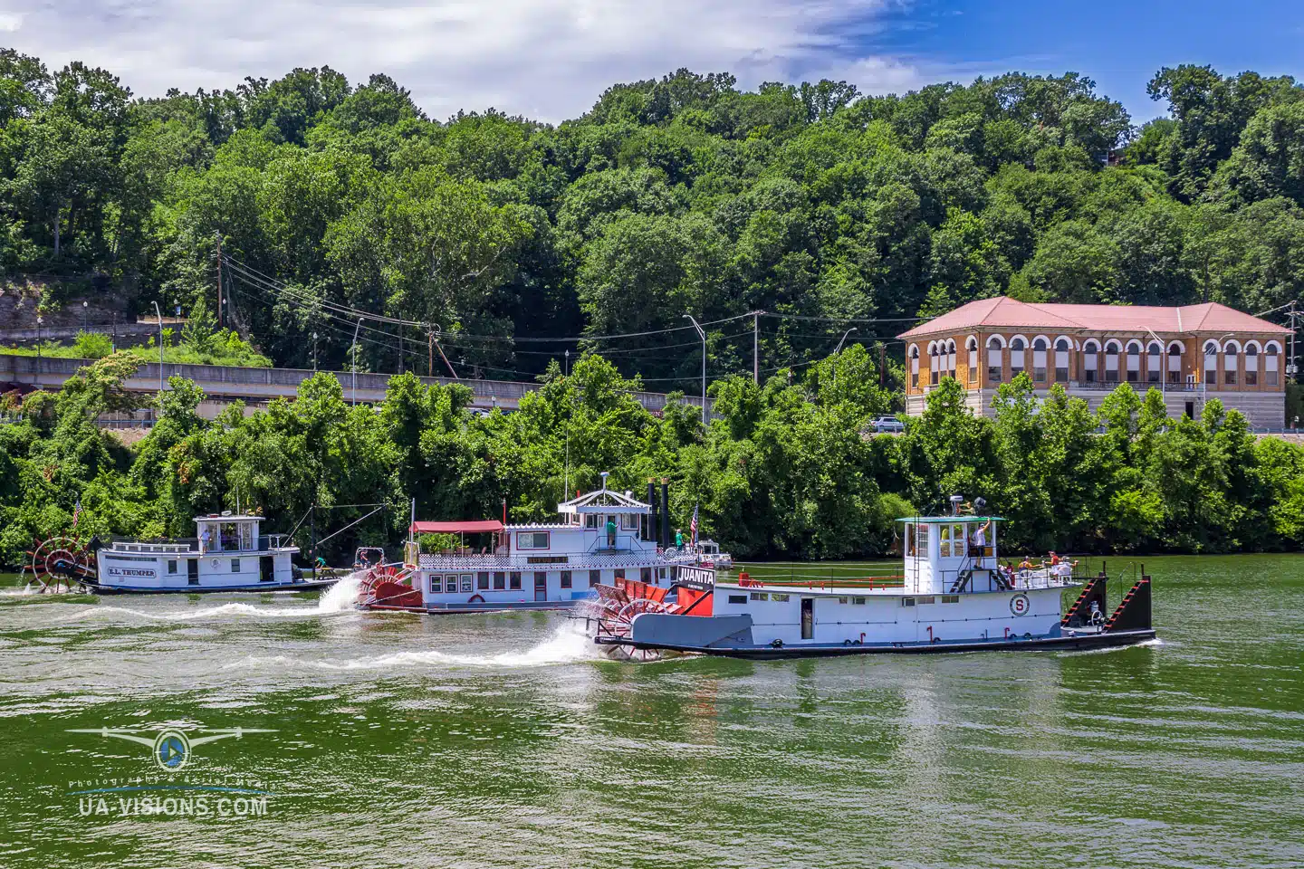 Several sternwheel boats in action during the 2022 Charleston Sternwheel Regatta boat race.